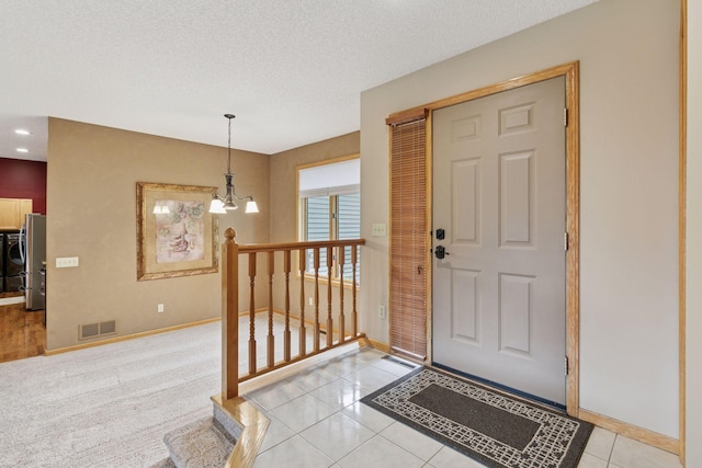 20886 Jenkins Way, Lakeville, MN 55044 - entryway featuring a textured ceiling, light tile patterned floors, and recessed lighting