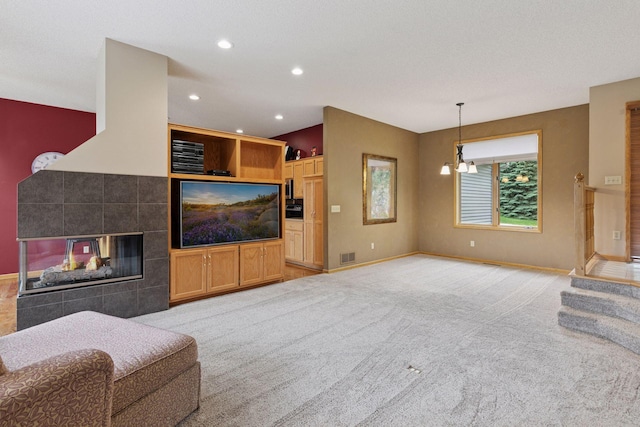 20886 Jenkins Way, Lakeville, MN 55044 - living room with recessed lighting, light carpet, a fireplace, and a chandelier