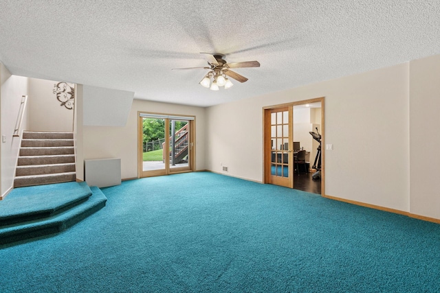 20886 Jenkins Way, Lakeville, MN 55044 - unfurnished living room with ceiling fan, carpet floors, stairway, and a textured ceiling
