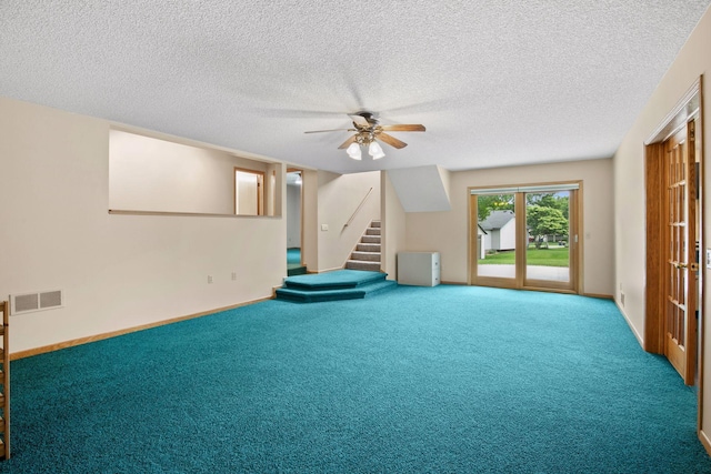 20886 Jenkins Way, Lakeville, MN 55044 - below grade area with stairway, a ceiling fan, carpet, and a textured ceiling