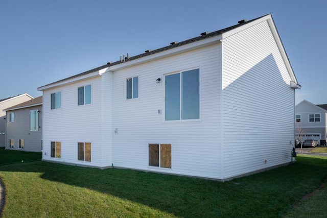 19892 English Ave N, Forest Lake, MN 55025 - rear view of house featuring a lawn