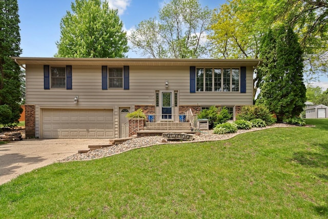 432 Garden Rd, Albert Lea, MN 56007 - bi-level home with a garage, concrete driveway, and a front lawn