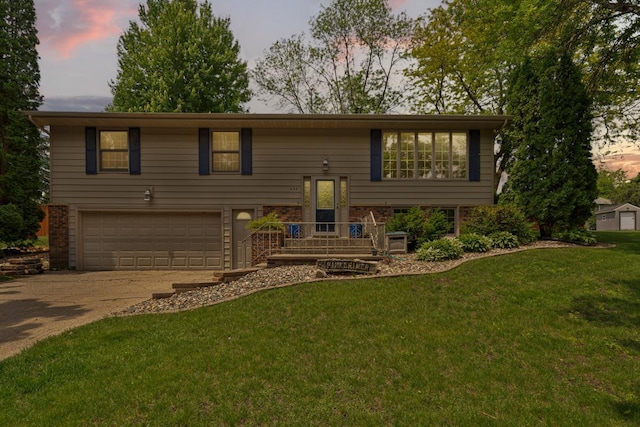 432 Garden Rd, Albert Lea, MN 56007 - bi-level home with an attached garage, driveway, and a lawn