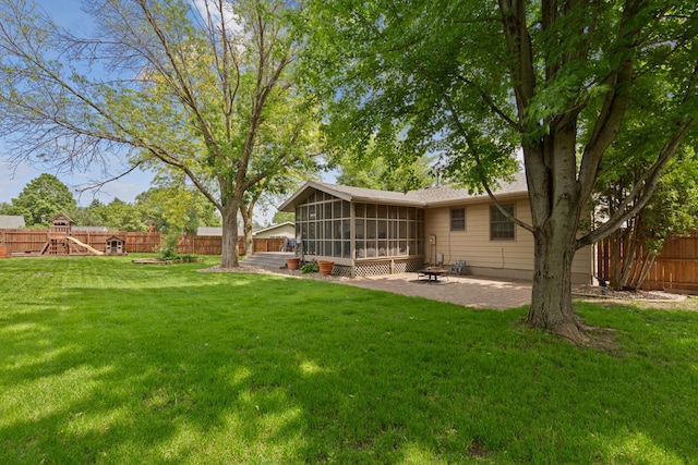 432 Garden Rd, Albert Lea, MN 56007 - view of yard featuring a sunroom, a patio area, and a playground
