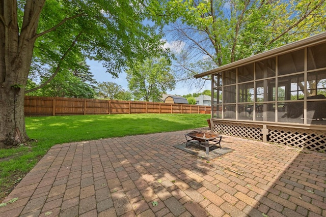 432 Garden Rd, Albert Lea, MN 56007 - view of patio / terrace with a sunroom and an outdoor fire pit