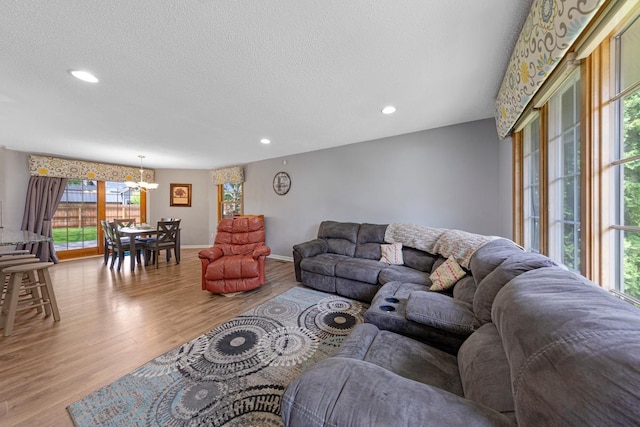 432 Garden Rd, Albert Lea, MN 56007 - living area featuring a chandelier, wood finished floors, recessed lighting, a textured ceiling, and baseboards