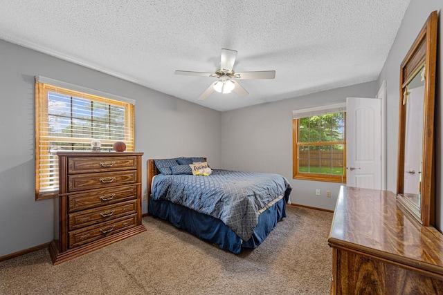 432 Garden Rd, Albert Lea, MN 56007 - bedroom with carpet floors, a textured ceiling, baseboards, and a ceiling fan