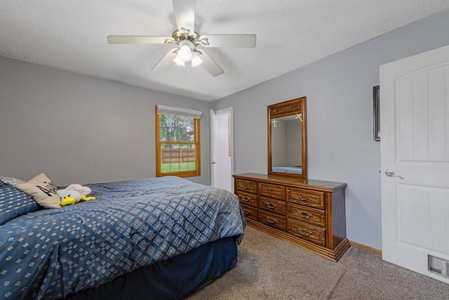 432 Garden Rd, Albert Lea, MN 56007 - carpeted bedroom featuring a textured ceiling and a ceiling fan