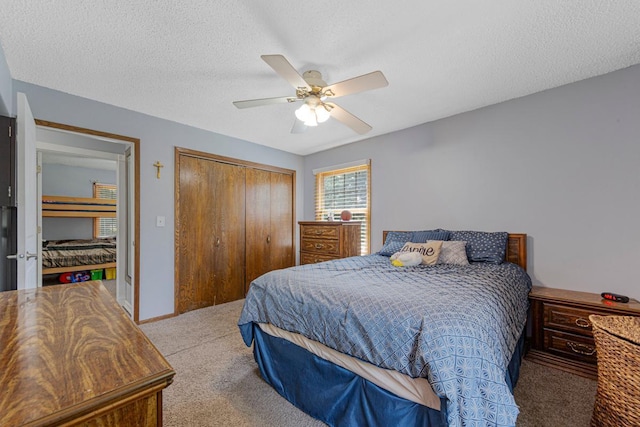 432 Garden Rd, Albert Lea, MN 56007 - bedroom with carpet flooring, a closet, a ceiling fan, and a textured ceiling