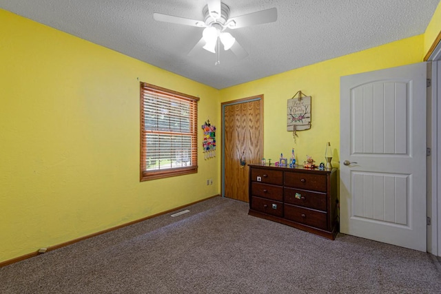432 Garden Rd, Albert Lea, MN 56007 - carpeted bedroom with a textured ceiling, a closet, and a ceiling fan
