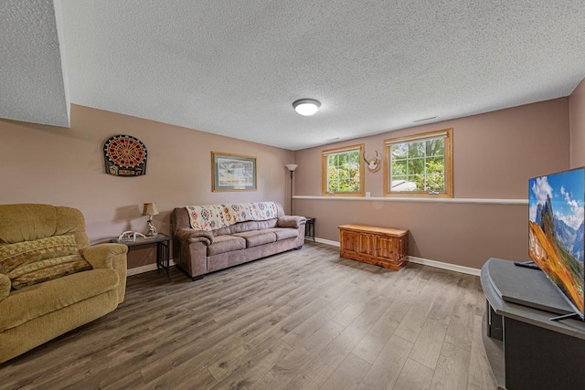 432 Garden Rd, Albert Lea, MN 56007 - living area featuring a textured ceiling, wood finished floors, and baseboards