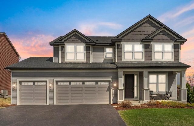 1270 Crosswinds Ct, Waconia, MN 55387 - craftsman inspired home featuring asphalt driveway, a porch, a yard, and a shingled roof