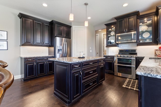 1270 Crosswinds Ct, Waconia, MN 55387 - kitchen featuring appliances with stainless steel finishes, dark wood-style flooring, light stone countertops, and recessed lighting