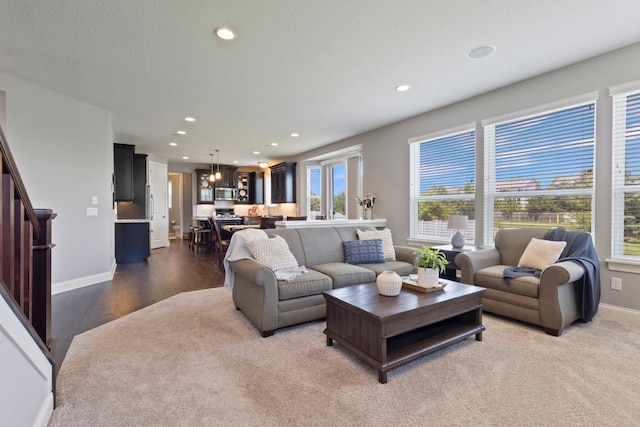 1270 Crosswinds Ct, Waconia, MN 55387 - living room with recessed lighting, a chandelier, baseboards, and wood finished floors