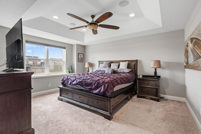 1270 Crosswinds Ct, Waconia, MN 55387 - carpeted bedroom featuring a tray ceiling, baseboards, recessed lighting, and ceiling fan