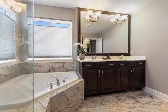 1270 Crosswinds Ct, Waconia, MN 55387 - full bathroom featuring double vanity, a garden tub, baseboards, a chandelier, and marble look tiles