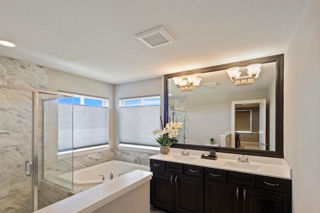 1270 Crosswinds Ct, Waconia, MN 55387 - bathroom featuring a garden tub, double vanity, a marble finish shower, and a textured ceiling