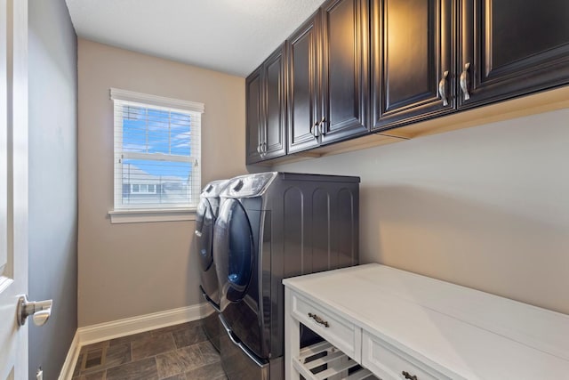 1270 Crosswinds Ct, Waconia, MN 55387 - washroom featuring washing machine and clothes dryer, baseboards, cabinet space, and stone finish flooring