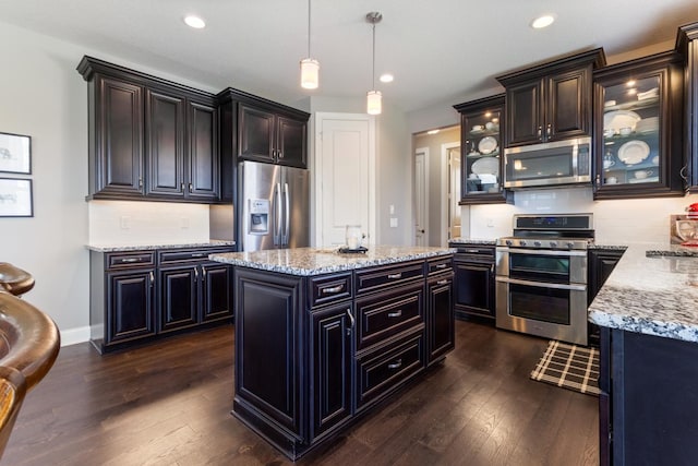 1270 Crosswinds Ct, Waconia, MN 55387 - kitchen with stainless steel appliances, dark wood finished floors, light stone countertops, and recessed lighting