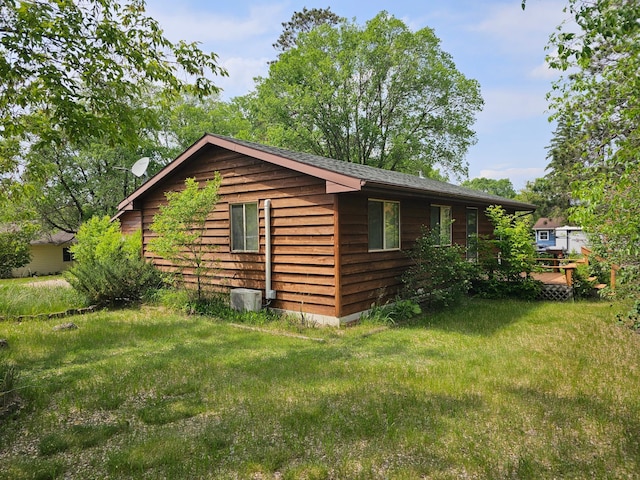 1701 Park Ave NW, Bemidji, MN 56601 - view of home's exterior featuring roof with shingles and a lawn