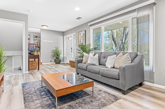 7136 145th St W, Apple Valley, MN 55124 - living room featuring light wood-style floors and baseboards