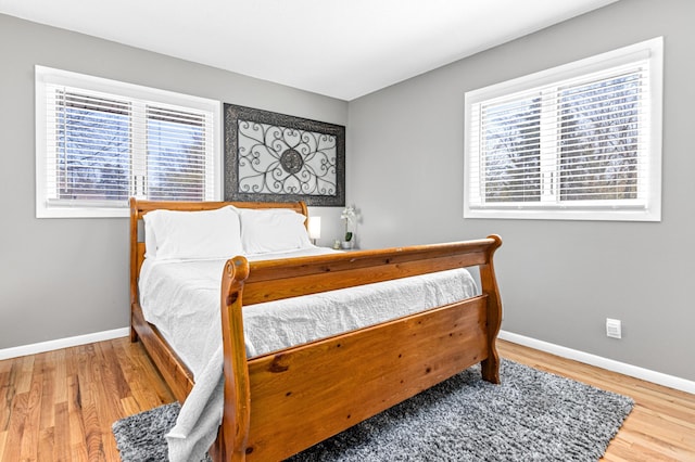 7136 145th St W, Apple Valley, MN 55124 - bedroom featuring baseboards and wood finished floors