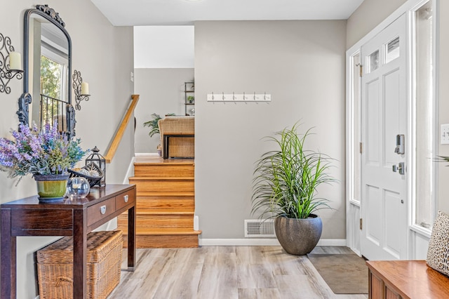 7136 145th St W, Apple Valley, MN 55124 - foyer with light wood-type flooring, baseboards, and stairway