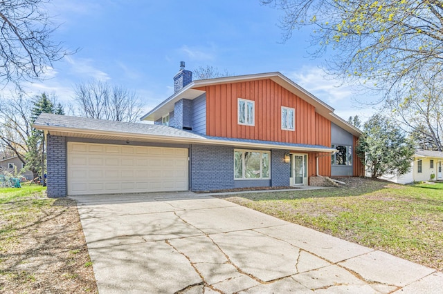 7136 145th St W, Apple Valley, MN 55124 - view of front of property featuring a chimney, brick siding, an attached garage, and concrete driveway