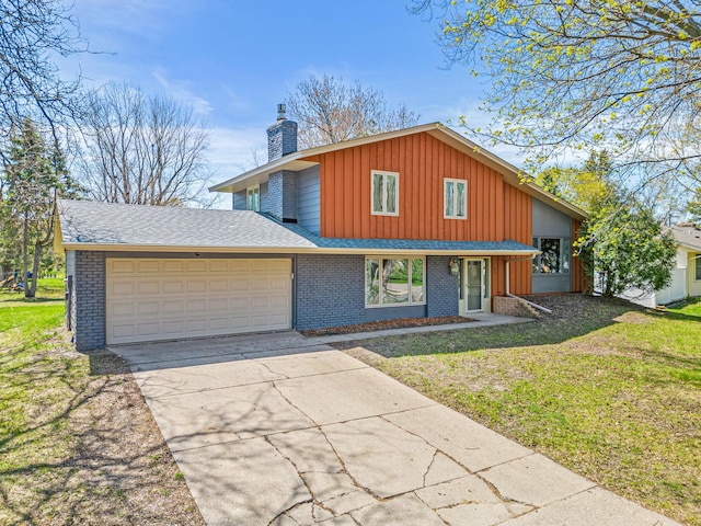 7136 145th St W, Apple Valley, MN 55124 - view of front of property with a garage, a chimney, board and batten siding, and a front lawn