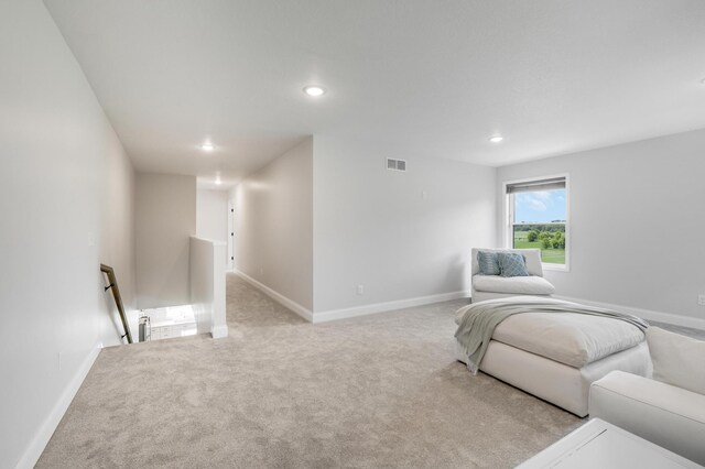9867 Kahler Ave NE, Monticello, MN 55362 - living area featuring an upstairs landing, recessed lighting, light colored carpet, and baseboards