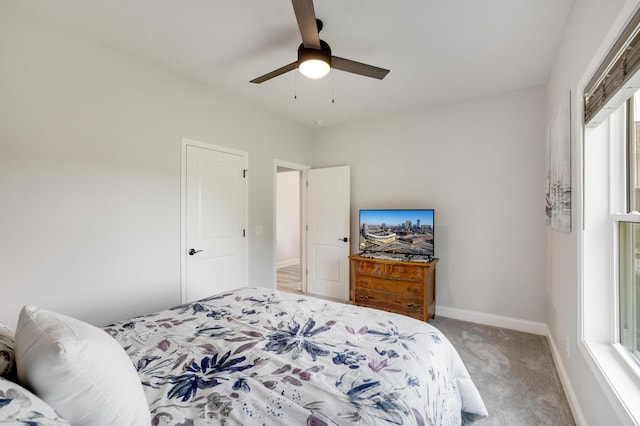 9867 Kahler Ave NE, Monticello, MN 55362 - bedroom featuring light colored carpet, ceiling fan, and baseboards