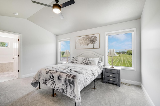 9867 Kahler Ave NE, Monticello, MN 55362 - bedroom featuring light colored carpet, vaulted ceiling, baseboards, and a ceiling fan