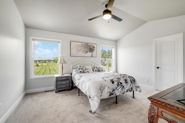 9867 Kahler Ave NE, Monticello, MN 55362 - bedroom with vaulted ceiling, light carpet, baseboards, and a ceiling fan