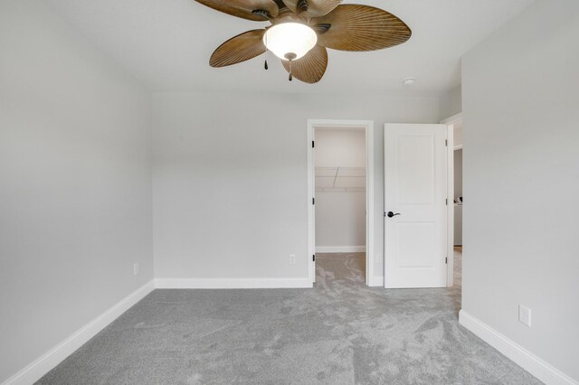 9867 Kahler Ave NE, Monticello, MN 55362 - unfurnished bedroom with carpet floors, a spacious closet, baseboards, a ceiling fan, and a closet