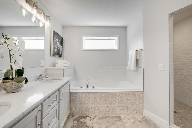 9867 Kahler Ave NE, Monticello, MN 55362 - full bathroom with a garden tub, double vanity, and walk in shower