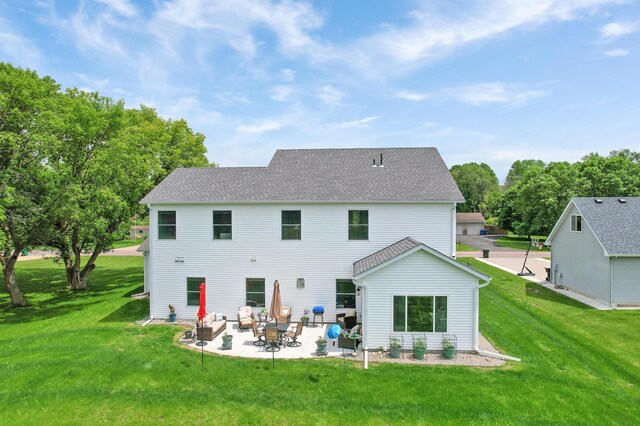 9867 Kahler Ave NE, Monticello, MN 55362 - back of house with a patio, a yard, and roof with shingles