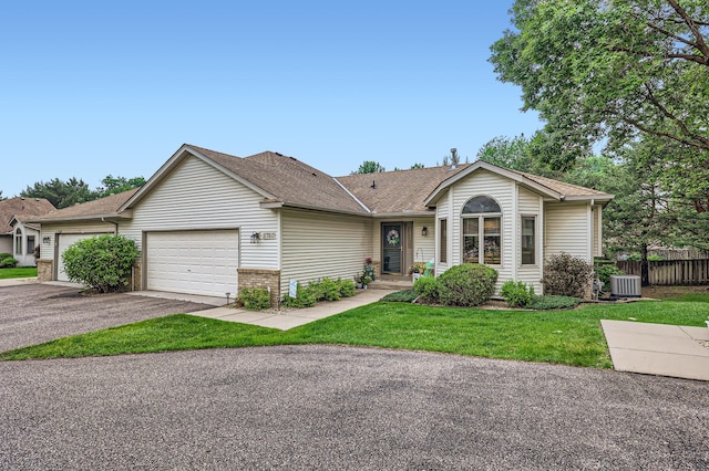 11760 88th Pl N, Maple Grove, MN 55369 - ranch-style home featuring a garage, driveway, and roof with shingles