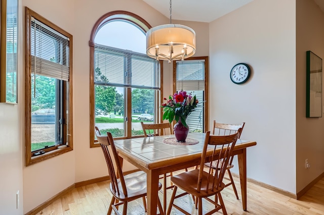 11760 88th Pl N, Maple Grove, MN 55369 - dining room with light wood finished floors and a chandelier