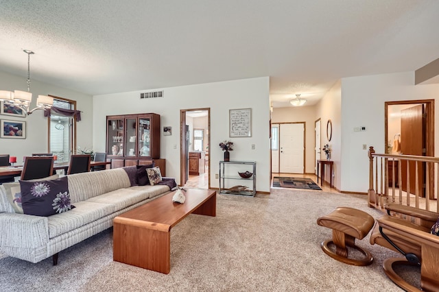 11760 88th Pl N, Maple Grove, MN 55369 - living room featuring carpet, healthy amount of natural light, a chandelier, and a textured ceiling