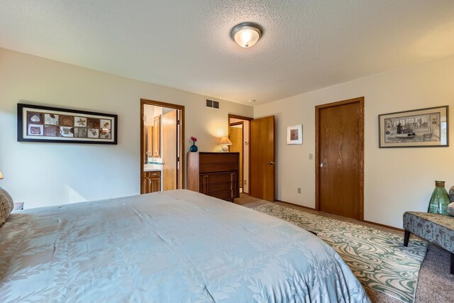 11760 88th Pl N, Maple Grove, MN 55369 - bedroom featuring light colored carpet and a textured ceiling