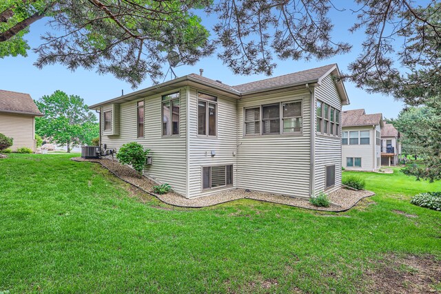 11760 88th Pl N, Maple Grove, MN 55369 - view of side of property with a cooling unit and a yard