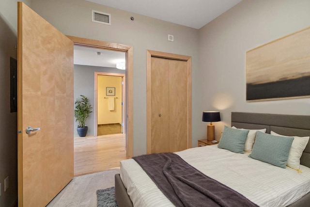 215 10th Ave S Unit 425, Minneapolis, MN 55415 - bedroom featuring a closet, electric panel, and wood finished floors