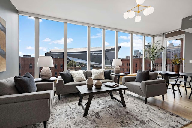 215 10th Ave S Unit 425, Minneapolis, MN 55415 - living room featuring wood finished floors, a chandelier, and expansive windows
