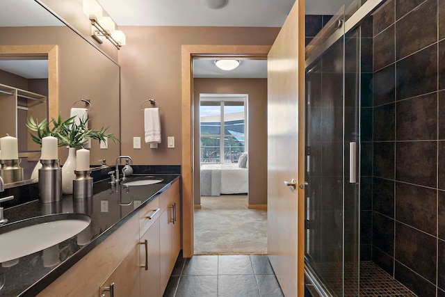 215 10th Ave S Unit 425, Minneapolis, MN 55415 - bathroom featuring double vanity, connected bathroom, a stall shower, and tile patterned flooring