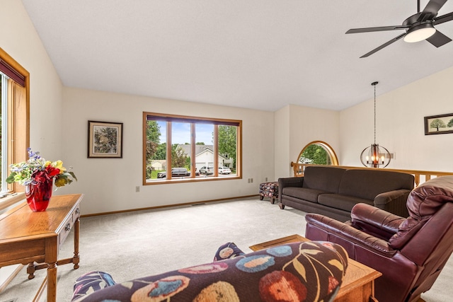 1201 Maplewood Dr, Delano, MN 55328 - living area featuring carpet floors, a chandelier, lofted ceiling, baseboards, and a ceiling fan