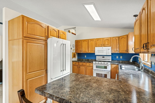 1201 Maplewood Dr, Delano, MN 55328 - kitchen with white appliances, a sink, a peninsula, lofted ceiling, and dark countertops