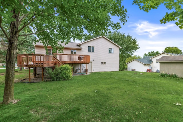 1201 Maplewood Dr, Delano, MN 55328 - rear view of property featuring a deck and a lawn