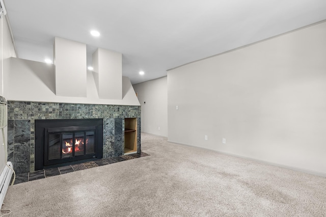 666 Ashland Ave Unit 5, Saint Paul, MN 55104 - unfurnished living room with carpet flooring, a tile fireplace, baseboard heating, and recessed lighting