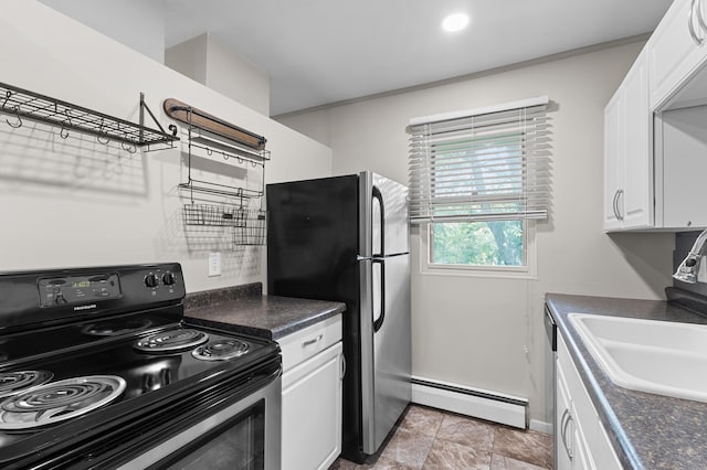 666 Ashland Ave Unit 5, Saint Paul, MN 55104 - kitchen featuring black electric range oven, baseboard heating, freestanding refrigerator, and dark countertops