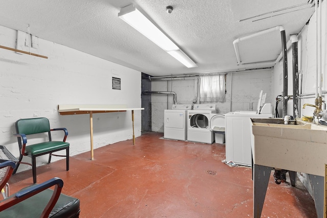 666 Ashland Ave Unit 5, Saint Paul, MN 55104 - below grade area featuring separate washer and dryer and a textured ceiling